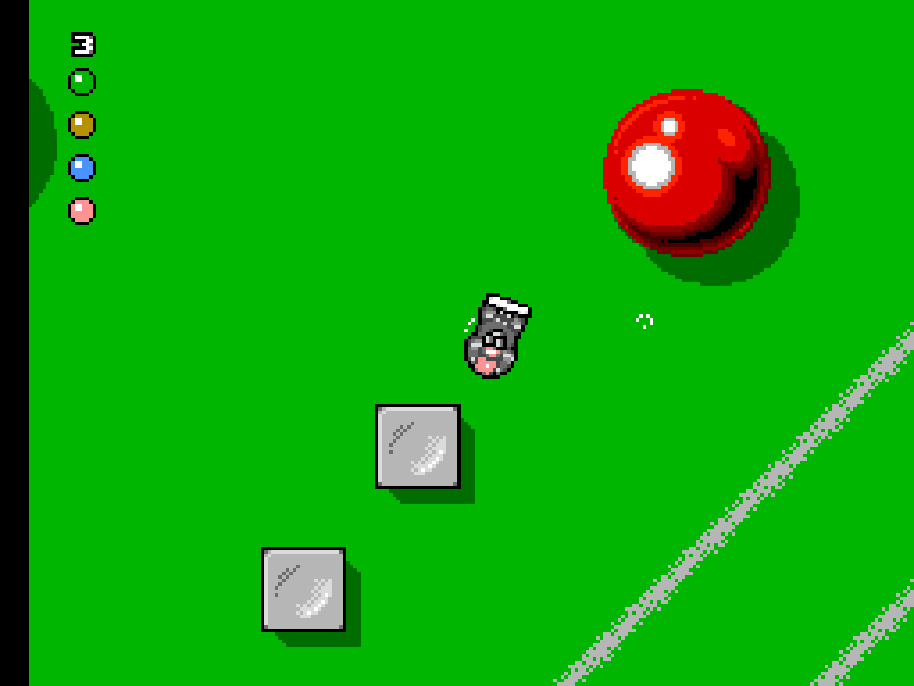 A car racing across a green pool table past a red ball.